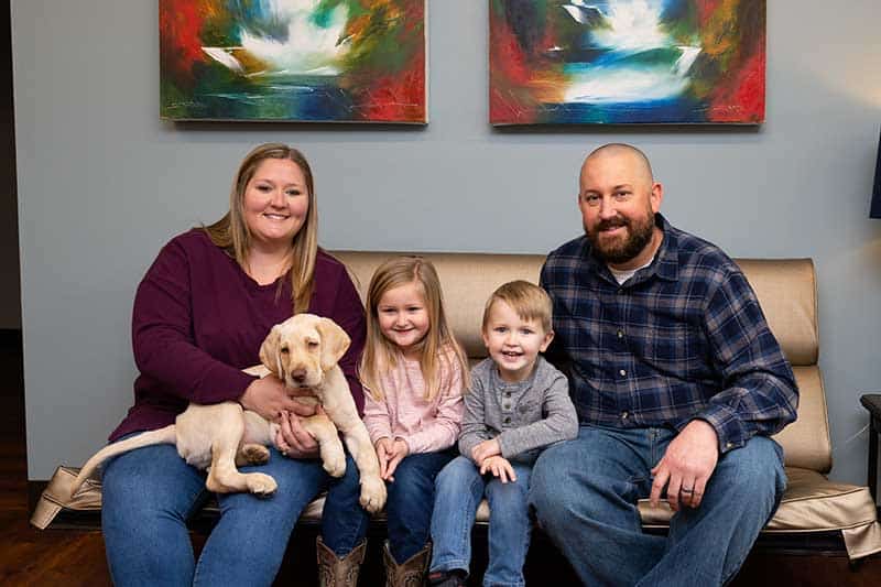A family with their puppy A family with their puppy